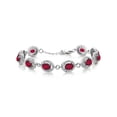 thumbnail image 1 of Gem Stone King 925 Sterling Silver Ruby Red Mystic Topaz Tennis Bracelet for Women (10.88 Cttw, Gemstone Birthstone, Oval 7X5MM, 7.5 inch), 1 of 3