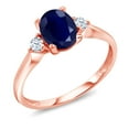 thumbnail image 1 of Gem Stone King 10K Rose Gold Blue Sapphire and White Created Sapphire 3 Stone Engagement Ring for Women (1.89 Cttw, Oval Gemstone Birthstone, Available in Size 5, 6, 7, 8, 9), 1 of 7