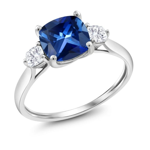 Gem Stone King 10K White Gold Blue Created Sapphire and Moissanite 3 Stone Engagement Ring for Women (2.26 Cttw, Cushion 7MM, Gemstone September Birthstone, Size 9.5)