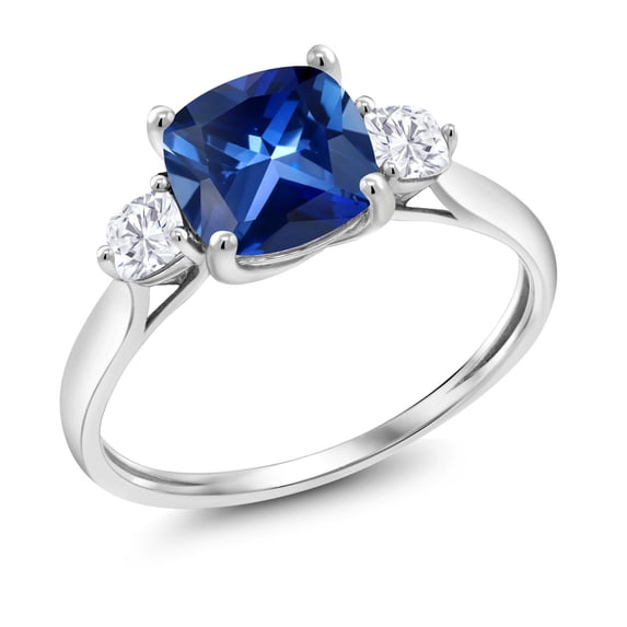Gem Stone King 10K White Gold Blue Created Sapphire and Moissanite 3 Stone Engagement Ring for Women (2.26 Cttw, Cushion 7MM, Gemstone September Birthstone, Size 5.5)
