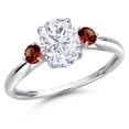 thumbnail image 1 of Gem Stone King 10K White Gold White Moissanite and Red Garnet 3-Stone Ring for Women | 1.80 Cttw | Oval 8X6MM | Gemstone Birthstone | Size 9, 1 of 6