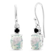 thumbnail image 1 of Gem Stone King 10K White Gold White Opal and Black Diamond Dangle Earrings for Women (2.23 Cttw, Gemstone Birthstone, Oval 8x6mm), 1 of 5