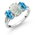 thumbnail image 1 of Gem Stone King 10K White Gold White Simulated Opal Swiss Blue Topaz and White Lab Grown Diamond 3 Stone Engagement Ring for Women (2.14 Cttw, Gemstone Birthstone, Size 5), 1 of 5