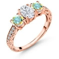 thumbnail image 1 of Gem Stone King 18K Rose Gold Plated Silver 3-Stone Ring Set with Oval Moissanite and Mystic Topaz (2.12 Cttw, Size 7), 1 of 6