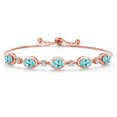 thumbnail image 1 of Gem Stone King 18K Rose Gold Plated Silver Blue Apatite and Moissanite Tennis Bracelet for Women | 4.10 Cttw | Gemstone Birthstone | Oval 7X5MM | Fully Adjustable 10 inch, 1 of 6