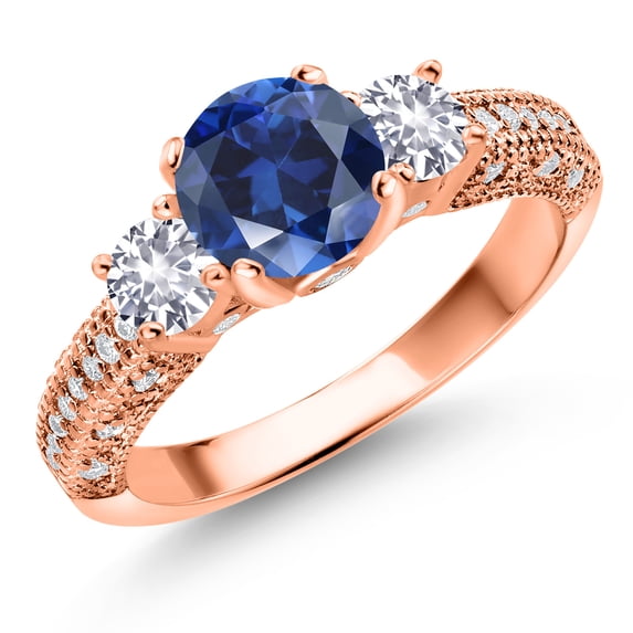 Gem Stone King 18K Rose Gold Plated Silver Blue Created Sapphire White Created Sapphire and White Moissanite Engagement Ring for Women (2.18 Ct, Gemstone September Birthstone, Round 7MM, Size 6)