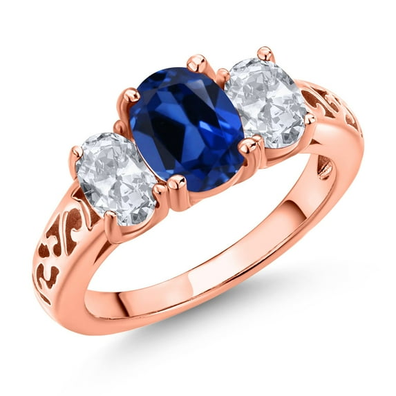 Gem Stone King 18K Rose Gold Plated Silver Blue Created Sapphire and White Topaz Filigree Style 3 Stone Ring for Women (2.80 Cttw, Oval 8X6MM and 6X4MM) (Size 9)