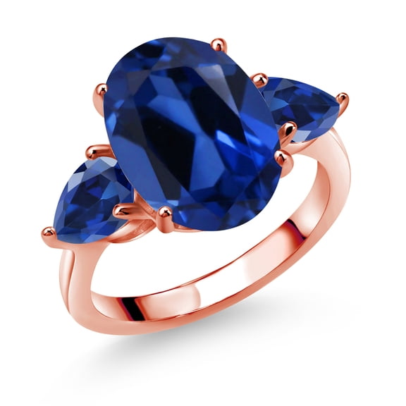 Gem Stone King 18K Rose Gold Plated Silver Blue Simulated Sapphire and Blue Created Sapphire Ring for Women (8.00 Cttw, 14X10MM Oval and 7X5MM Pear Shape, Gemstone, Size 7)