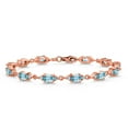 thumbnail image 1 of Gem Stone King 18K Rose Gold Plated Silver Blue Zircon and White Moissanite Tennis Bracelet for Women (8.71 Cttw, Gemstone Birthstone, Oval 6X4MM, 6.5 inch), 1 of 5