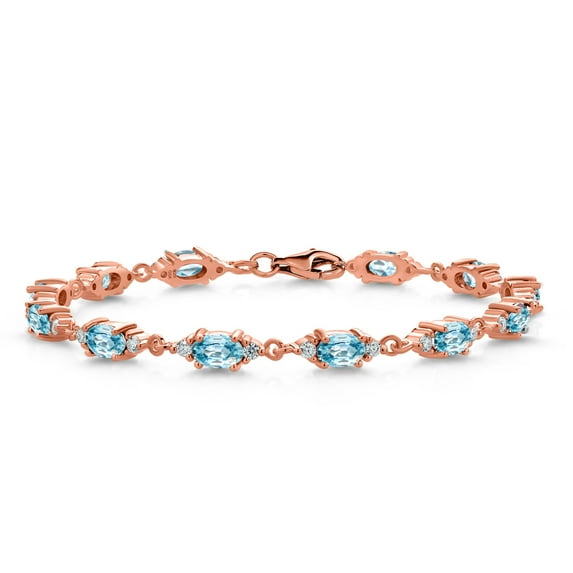 Gem Stone King 18K Rose Gold Plated Silver Blue Zircon and White Moissanite Tennis Bracelet for Women (8.71 Cttw, Gemstone Birthstone, Oval 6X4MM, 6.5 inch)