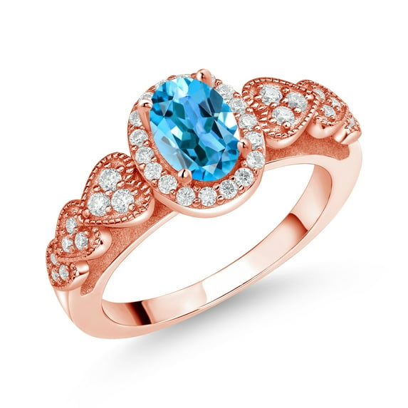 Gem Stone King 18K Rose Gold Plated Silver Swiss Blue Topaz and White Moissanite Engagement Ring for Women | 1.18 Cttw | Oval 7X5MM | Gemstone November Birthstone | Size 6