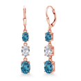 thumbnail image 1 of Gem Stone King 18K Rose Gold Plated Silver London Blue Topaz 3 Stone Dangle Earrings for Women (6.20 Cttw, Gemstone November Birthstone, Oval 8X6MM, 7X5MM and 6X4MM), 1 of 6