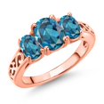 thumbnail image 1 of Gem Stone King 18K Rose Gold Plated Silver London Blue Topaz Filigree Style 3 Stone Ring for Women (2.70 Cttw, Oval 8X6MM and 6X4MM) (Size 9), 1 of 6