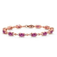 thumbnail image 1 of Gem Stone King 18K Rose Gold Plated Silver Pink Created Sapphire and White Moissanite Tennis Bracelet for Women (6.91 Cttw, Gemstone Birthstone, Oval 6X4MM, 6.5 inch), 1 of 5