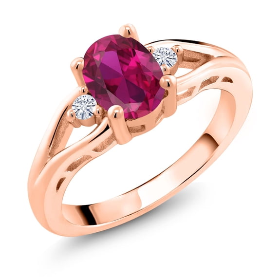 Gem Stone King 18K Rose Gold Plated Silver Red Created Ruby and White Moissanite 3 Stone Engagement Ring for Women | 1.43 Cttw | Oval 8X6MM | Round 2MM | Gemstone July Birthstone | Size 5