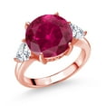 thumbnail image 1 of Gem Stone King 18K Rose Gold Plated Silver Red Created Ruby and White Moissanite 3-Stone Ring for Women (7.94 Cttw, Round 12MM, Trillion 5MM, Size 8), 1 of 3