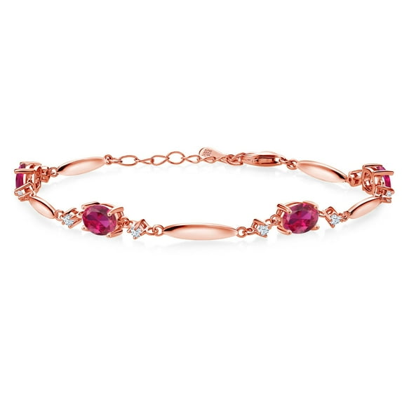 Gem Stone King 18K Rose Gold Plated Silver Red Created Ruby and White Zirconia Tennis Bracelet for Women | 4.24 Cttw | Gemstone July Birthstone | Oval 7X5MM | 6 inch + 1 inch Extender