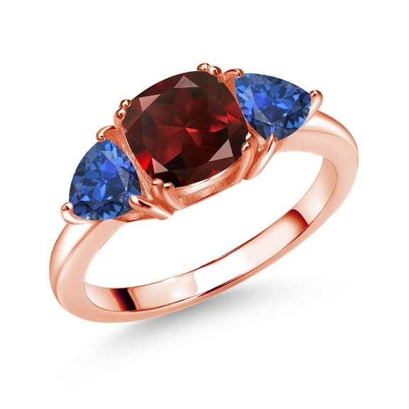 Gem Stone King 18K Rose Gold Plated Silver Red Garnet and Blue Created Sapphire 3 Stone Engagement Ring for Women (2.93 Cttw, Gemstone January Birthstone, Available in Size 5, 6, 7, 8, 9)