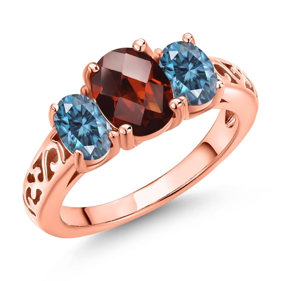 Gem Stone King 18K Rose Gold Plated Silver Red Garnet and Persian Blue Moissanite Filigree Style 3 Stone Ring for Women (2.43 Cttw, Oval 8X6MM and 6X4MM) (Size 8)