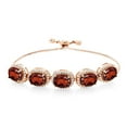 thumbnail image 1 of Gem Stone King 18K Rose Gold Plated Silver Red Garnet Tennis Bracelet for Women (11.68 Cttw, Oval 9X7MM, Gemstone January Birthstone, Fully Adjustable up to 9 inch), 1 of 3