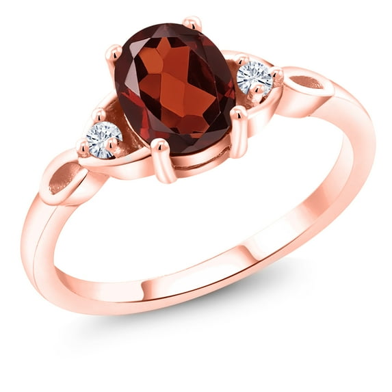 Gem Stone King 18K Rose Gold Plated Silver Red Garnet and White Moissanite 3-Stone Rings for Women (1.58 Cttw, Gemstone January Birthstone, Oval 8X6MM, Available in Size 5, 6, 7, 8, 9)
