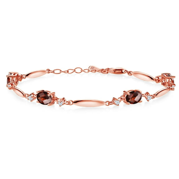 Gem Stone King 18K Rose Gold Plated Silver Red Garnet and White Zirconia Tennis Bracelet for Women | 4.24 Cttw | Gemstone January Birthstone | Oval Checkerboard 7X5MM | 6 inch + 1 inch Extender