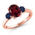 thumbnail image 1 of Gem Stone King 18K Rose Gold Plated Silver Red Rhodolite Garnet and Blue Sapphire Engagement Ring for Women | 2.70 Cttw | Oval 9X7MM | Gemstone January Birthstone | Size 9, 1 of 6