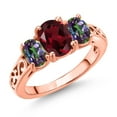thumbnail image 1 of Gem Stone King 18K Rose Gold Plated Silver Red Rhodolite Garnet and Green Mystic Topaz Filigree Style 3 Stone Ring for Women (2.55 Cttw, Oval 8X6MM and 6X4MM, Size 9) (Size 9), 1 of 6