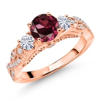 Gem Stone King 18K Rose Gold Plated Silver Red Rhodolite Garnet and White Moissanite Engagement Ring for Women (1.47 Cttw, Gemstone January Birthstone, Round 6MM and 3MM, Size 5)