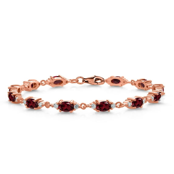 Gem Stone King 18K Rose Gold Plated Silver Red Rhodolite Garnet and White Moissanite Tennis Bracelet for Women (6.91 Cttw, Gemstone Birthstone, Oval 6X4MM, 7.5 inch)