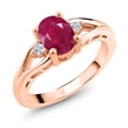 thumbnail image 1 of Gem Stone King 18K Rose Gold Plated Silver Red Ruby and White Lab Grown Diamond 3 Stone Engagement Ring for Women | 1.68 Cttw | Oval 8X6MM | Round 2MM | Gemstone July Birthstone | Size 5, 1 of 6