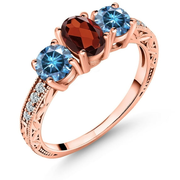 Gem Stone King 18K Rose Gold Plated Silver 3-Stone Ring Oval Red Garnet and Vivid Persian Blue Moissanite (1.99 Cttw, Size 5)