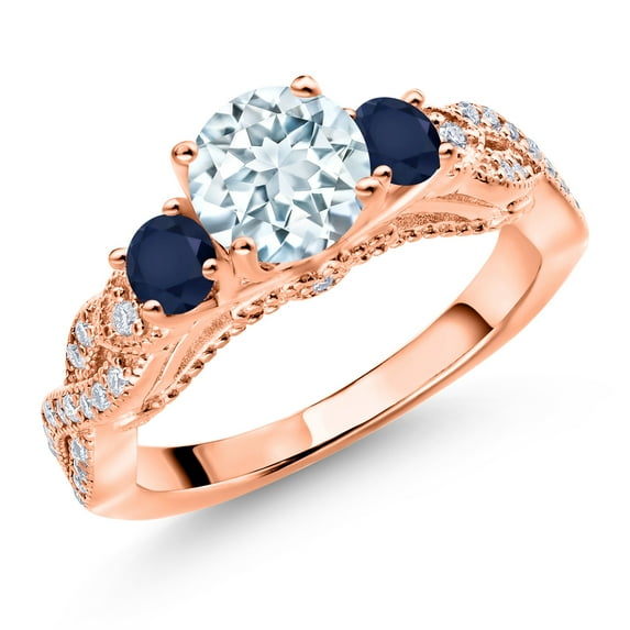 Gem Stone King 18K Rose Gold Plated Silver Sky Blue Aquamarine Blue Sapphire and White Moissanite Engagement Ring for Women (1.32 Cttw, Gemstone March Birthstone, Round 6MM and 3MM, Size 7)