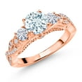 thumbnail image 1 of Gem Stone King 18K Rose Gold Plated Silver Sky Blue Aquamarine and White Moissanite Engagement Ring for Women (1.22 Cttw, Gemstone March Birthstone, Round 6MM and 3MM, Size 6), 1 of 4
