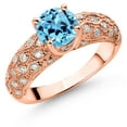 thumbnail image 1 of Gem Stone King 18K Rose Gold Plated Silver Swiss Blue Topaz and White Moissanite Engagement Ring for Women (1.99 Cttw, Round 7MM, Gemstone November Birthstone, Size 5), 1 of 3