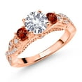thumbnail image 1 of Gem Stone King 18K Rose Gold Plated Silver White Created Sapphire Red Garnet and White Moissanite Engagement Ring for Women (1.57 Cttw, Gemstone September Birthstone, Round 6MM and 3MM, Size 6), 1 of 4