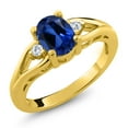 thumbnail image 1 of Gem Stone King 18K Yellow Gold Plated Silver Blue Created Sapphire and White Moissanite 3 Stone Engagement Ring for Women | 1.68 Cttw | Oval 8X6MM | Round 2MM | Gemstone September Birthstone | Size 9, 1 of 5