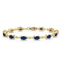 Gem Stone King 18K Yellow Gold Plated Silver Blue Created Sapphire and White Moissanite Tennis Bracelet for Women (8.11 Cttw, Gemstone Birthstone, Oval 6X4MM, 7.5 inch)