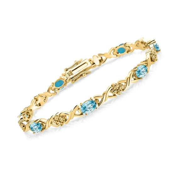 Gem Stone King 18K Yellow Gold Plated Silver Blue Zircon Tennis Bracelet for Women (4.55 Cttw, Gemstone December Birthstone, Oval 6X4MM, 7 inch)