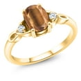thumbnail image 1 of Gem Stone King 18K Yellow Gold Plated Silver Brown Tiger Eye and White Zirconia 3-Stone Rings for Women (1.31 Cttw, Gemstone, Oval 8X6MM, Available in Size 5, 6, 7, 8, 9), 1 of 4