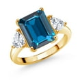 thumbnail image 1 of Gem Stone King 18K Yellow Gold Plated Silver London Blue Topaz and White Moissanite 3 Stone Ring for Women (8.44 Cttw, Emerald Cut 12X10MM, Trillion 5X5MM, Gemstone November Birthstone, Size 9), 1 of 3