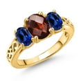 thumbnail image 1 of Gem Stone King 18K Yellow Gold Plated Silver Red Garnet and Blue Created Sapphire Filigree Style 3 Stone Ring for Women (2.73 Cttw, Oval 8X6MM and 6X4MM) (Size 8), 1 of 6