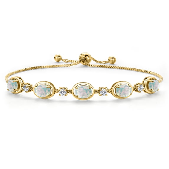 Gem Stone King 18K Yellow Gold Plated Silver Simulated White Opal and Moissanite Tennis Bracelet for Women | 5.00 Cttw | Gemstone October Birthstone | Oval Cabochon 7X5MM | Fully Adjustable 10 inch