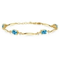thumbnail image 1 of Gem Stone King 18K Yellow Gold Plated Silver Swiss Blue Topaz and White Topaz Tennis Bracelet for Women | 4.32 Cttw | Gemstone November Birthstone | Oval 7X5MM | 6 inch + 1 inch Extender, 1 of 3