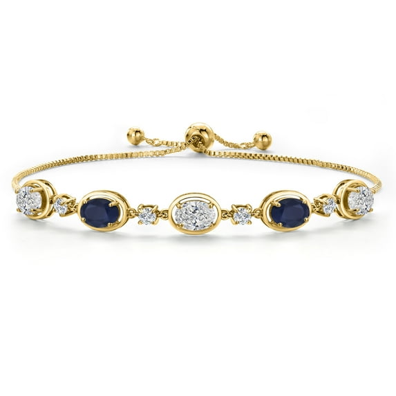 Gem Stone King 18K Yellow Gold Plated Silver White Lab Grown Diamond and Blue Sapphire Bracelet for Women | 4.10 Cttw | Gemstone April Birthstone | Oval 7X5MM | Fully Adjustable 9 inch
