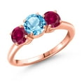 thumbnail image 1 of Gem Stone King 18K Rose Gold Plated Silver Swiss Blue Topaz and Red Created Ruby Engagement Ring for Women | 2.20 Cttw | Round 6MM | Gemstone November Birthstone | Size 8, 1 of 6