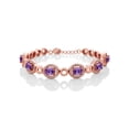 thumbnail image 1 of Gem Stone King 18K Rose Gold Plated Silver Purple Amethyst Tennis Bracelet for Women (6.42 Cttw, Gemstone Birthstone, Oval 7X5MM, 7 inch with 1 inch Extender), 1 of 3