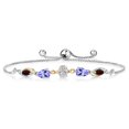 thumbnail image 1 of Gem Stone King 925 Silver and 10K Yellow Gold Lab Grown Diamond, Blue Tanzanite and Red Garnet Bracelet for Women | 1.65 Cttw | Gemstone April Birthstone | Oval 6X4MM | Fully Adjustable 9 inch, 1 of 3