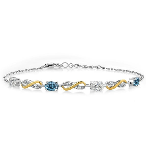 Gem Stone King 925 Silver and 10K Yellow Gold Lab Grown Diamond and Persian Blue Moissanite Bracelet for Women | 1.75 Cttw | Gemstone April Birthstone | Oval 6X4MM | Fully Adjustable 9"
