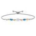 thumbnail image 1 of Gem Stone King 925 Silver and 10K Yellow Gold White Moissanite and Swiss Blue Topaz and Lab Grown Diamond Bracelet for Women | 2.06 Cttw | Gemstone | Oval 7X5MM | Fully Adjustable 9", 1 of 5